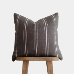 warm charcoal Moroccan pillow with horizontal cream stripes – handmade cotton cushion for neutral and bohemian interiors