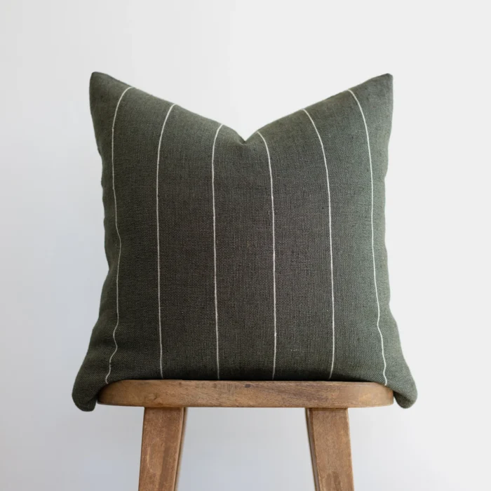 Front view of moss green Moroccan pillow with horizontal off-white stripes – handcrafted cotton cushion for earthy and boho interior decor