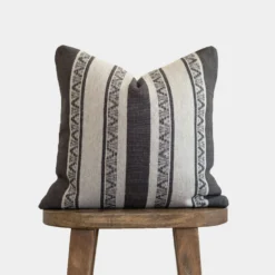 handwoven warm charcoal Moroccan pillow with cream horizontal stripes and artisan embroidery – decorative cotton cushion in 18", 20", and 24" sizes