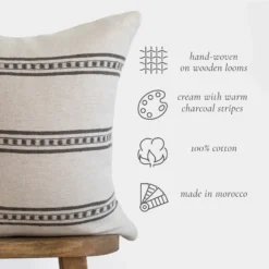 Handcrafted Moroccan cotton pillow cover in white with mocha brown lines styled on a sofa – cozy and elegant décor accent for living spaces
