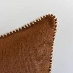 handcrafted Moroccan pillow in spice tone with soft cream edge stitching – natural cotton cushion for warm home aesthetics