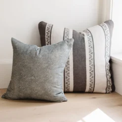 handwoven Moroccan pillow in charcoal with cream stripes and subtle embroidery – handmade cotton cushion cover available in three sizes