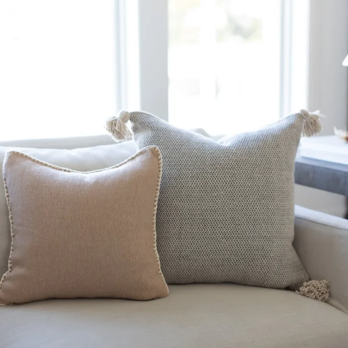 Side profile of a boho Moroccan tan cushion with artisan cream embroidery – handmade cotton pillow for natural, cozy interior spaces