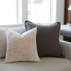 Charcoal Moroccan cushion with hand-stitch detail styled in a neutral-toned interior with earthy textures – handmade pillow perfect for cozy modern homes