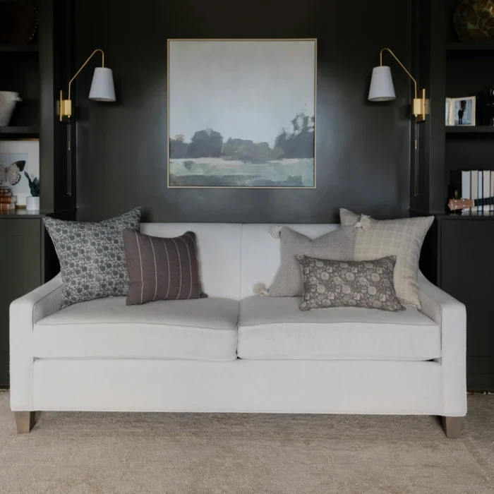 Warm charcoal pillows styled on a contemporary couch – handwoven Moroccan cotton cushions for cozy and modern living spaces