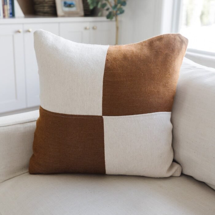 Boho-styled living room with cream and spice Moroccan pillow on a neutral couch – handmade cotton accent cushion for modern home décor