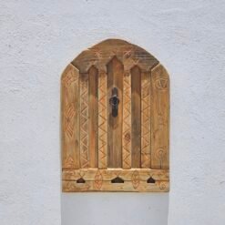 Berber carvings on reclaimed cedar wood panel with vintage finish