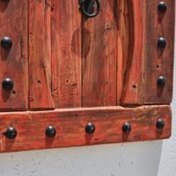 red wood and iron nails on bottom part of Moroccan decorative panel