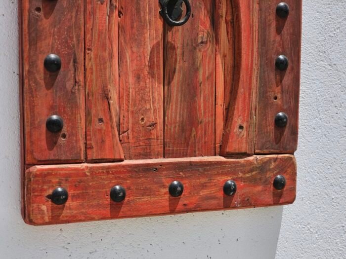 red wood and iron nails on bottom part of Moroccan decorative panel