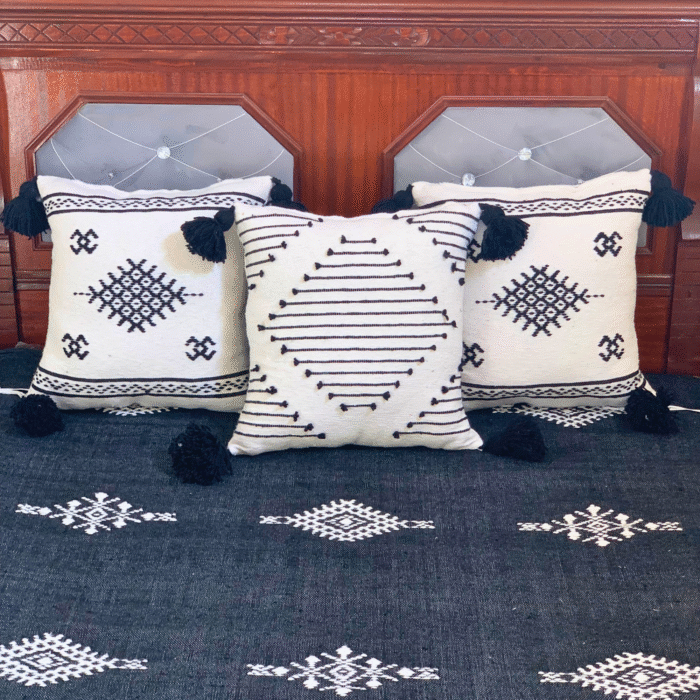 Three black Moroccan cotton pillows hand-embroidered in white – included in luxury handmade blanket set