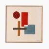 Framed Kanica wool wall art hanging on a neutral wall, adding warmth and texture to a modern boho living room