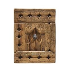 Handcrafted vintage Moroccan wall panel featuring tribal Berber carvings and rustic aged wood