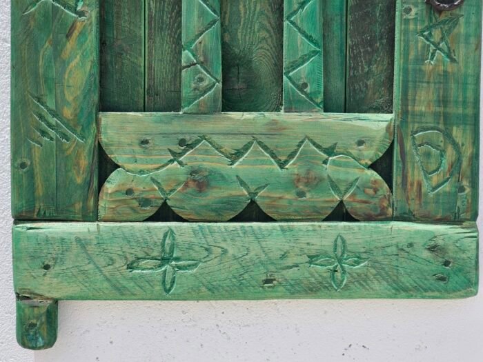 Moroccan vintage window panel showing aged wood texture and traditional craftsmanship