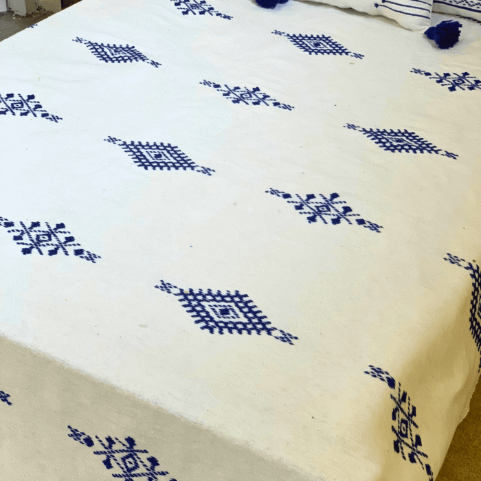 White Moroccan wool blanket handwoven and embroidered with blue pattern
