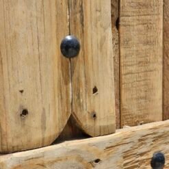 Close-up of natural wood textures and hand-carved grooves in Moroccan