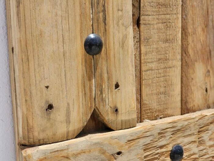 Close-up of natural wood textures and hand-carved grooves in Moroccan