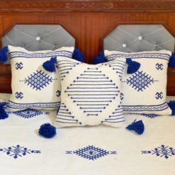 Handcrafted Moroccan pillows in white with detailed blue embroidery – included in handmade cotton blanket set