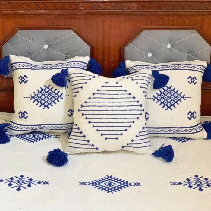 Handcrafted Moroccan pillows in white with detailed blue embroidery – included in handmade cotton blanket set
