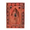 Vintage Moroccan wall panel with Moorish arch design in red rustic wood, mounted on white wall