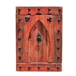 Vintage Moroccan wall panel with Moorish arch design in red rustic wood, mounted on white wall