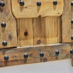 Bottom panel view of the rustic Moroccan shutter with visible wood grain and iron rivets