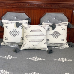 Three grey Moroccan wool pillows embroidered in white – part of elegant handmade blanket set