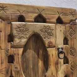 Intricate Berber-Inspired Carvings and Rustic Finish on Amazigh Wooden Panel