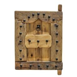 vintage wooden Moroccan shutter with black iron studs
