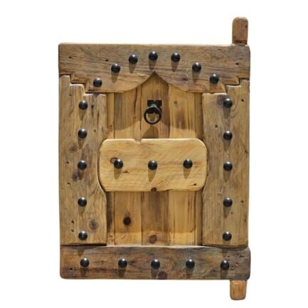 vintage wooden Moroccan shutter with black iron studs