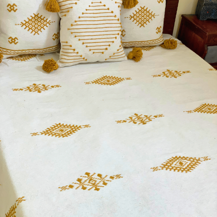 Moroccan wool blanket in white with mustard hand embroidery – elegant throw with matching cushions