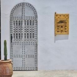 Berber carvings on reclaimed cedar wood panel
