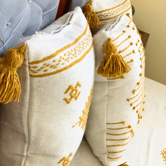 Moroccan handwoven pillowcases in white with mustard yellow embroidery