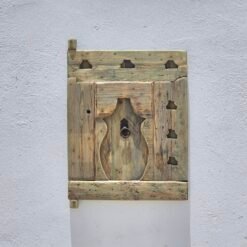 Berber carvings on aged cedar wood panel