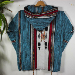 showing hood and shoulder details of turquoise and black patterned handmade Moroccan hoodie, unisex boho jacket with premium fleece and wool."
