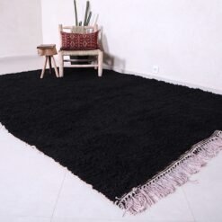 Moroccan black Beni Ourain rug, capturing the clean lines, bold color, and artisanal quality. Perfect for floor styling in contemporary homes or artistic wall display in design-forward interiors.