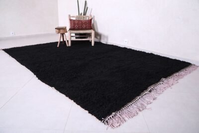 Moroccan black Beni Ourain rug, capturing the clean lines, bold color, and artisanal quality. Perfect for floor styling in contemporary homes or artistic wall display in design-forward interiors.