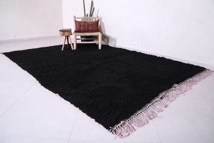 Moroccan black Beni Ourain rug, capturing the clean lines, bold color, and artisanal quality. Perfect for floor styling in contemporary homes or artistic wall display in design-forward interiors.