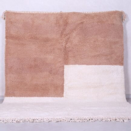 Contemporary handmade Moroccan Beni Ourain rug in ivory and tan, crafted with 100% natural lamb wool and traditional Berber weaving.