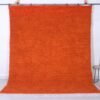 Authentic handmade Moroccan orange Beni Ourain rug crafted with 100% natural wool by Berber artisans, featuring vibrant rustic orange color and traditional geometric Berber tribal patterns, perfect for living rooms and cozy interiors.