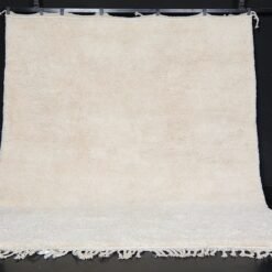 custom ivory Moroccan rug with traditional Berber weaving, solid creamy wool texture, and artisanal craftsmanship