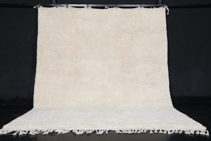 custom ivory Moroccan rug with traditional Berber weaving, solid creamy wool texture, and artisanal craftsmanship