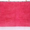 Handmade Moroccan rose pink wool rug with soft Beni Ourain texture.