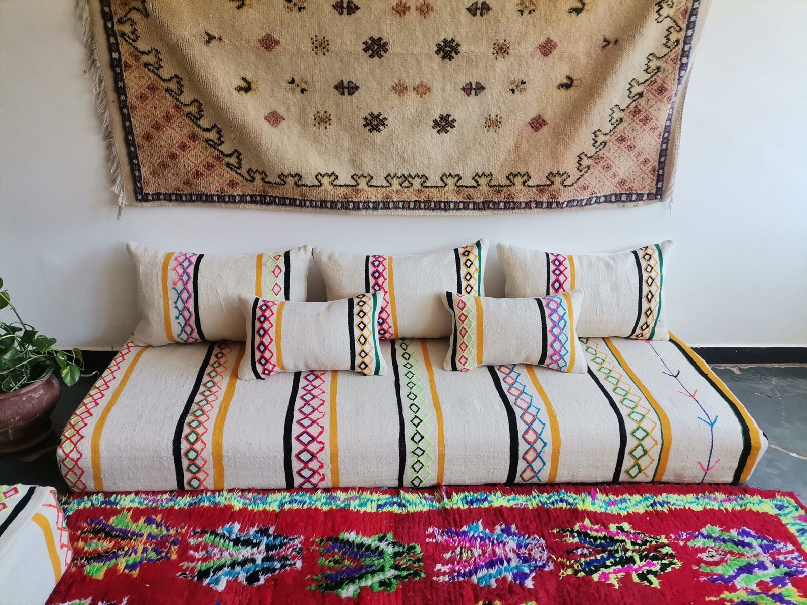 Bohemian living room with ivory Moroccan floor sofa set featuring multicolor embroidery