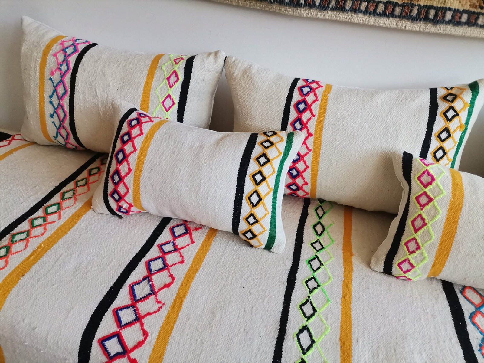 Unstuffed Moroccan floor cushions with zippered covers laid flat