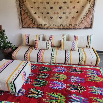 Handmade Moroccan wool floor sofa set with ivory base and vibrant multicolor Berber embroidery, unstuffed cushion covers with zippers