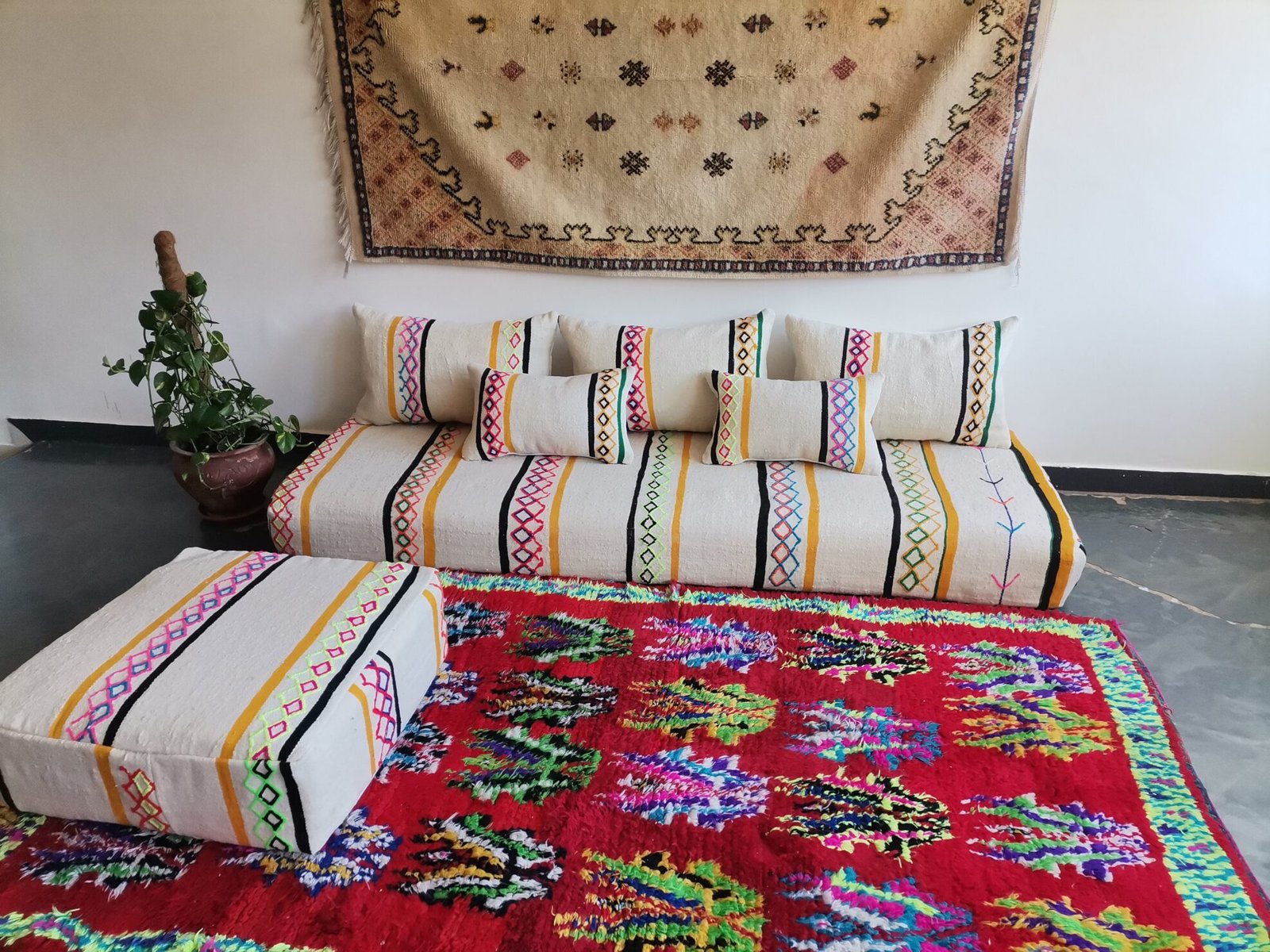 Handmade Moroccan wool floor sofa set with ivory base and vibrant multicolor Berber embroidery, unstuffed cushion covers with zippers