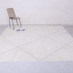 Moroccan wool rug featuring tan geometric trellis design, showing thick plush wool texture and expert hand-knotting.