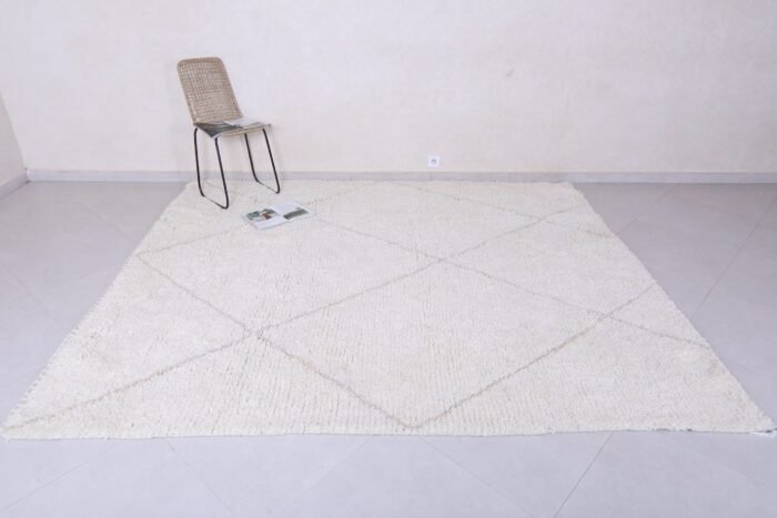 Moroccan wool rug featuring tan geometric trellis design, showing thick plush wool texture and expert hand-knotting.