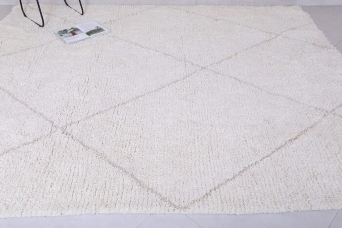 custom-sized white and tan Moroccan rug, emphasizing soft wool pile and elegant geometric design.