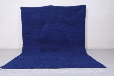 Moroccan royal blue Beni Ourain rug highlighting soft, thick wool pile and detailed hand-knotted Berber patterns in deep blue tone.